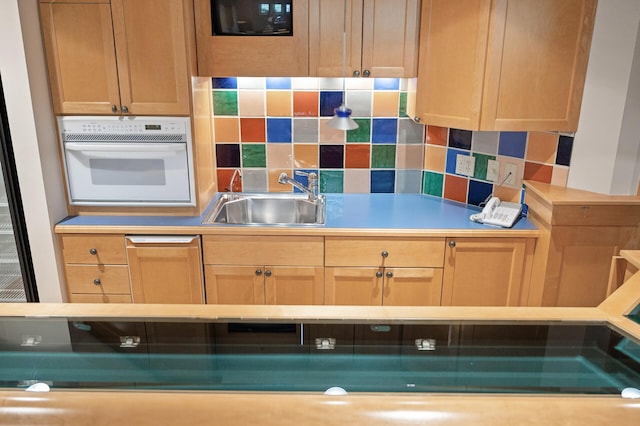 781 Ferndale Rd N, Orono, MN 55391 - kitchen with light countertops, oven, decorative backsplash, and a sink