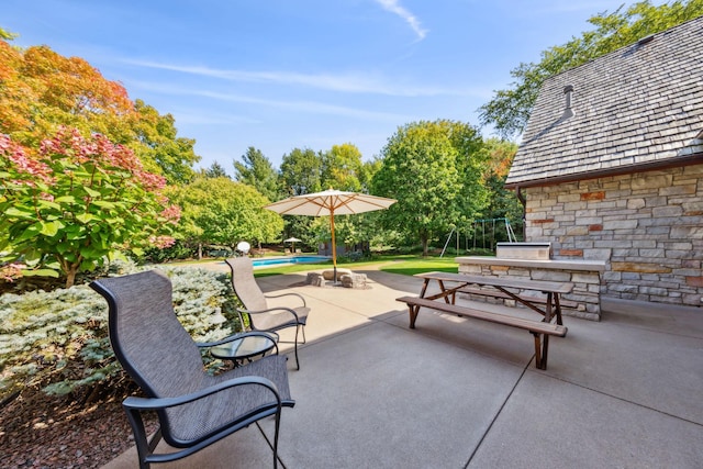 781 Ferndale Rd N, Orono, MN 55391 - view of patio with an outdoor kitchen and an outdoor pool