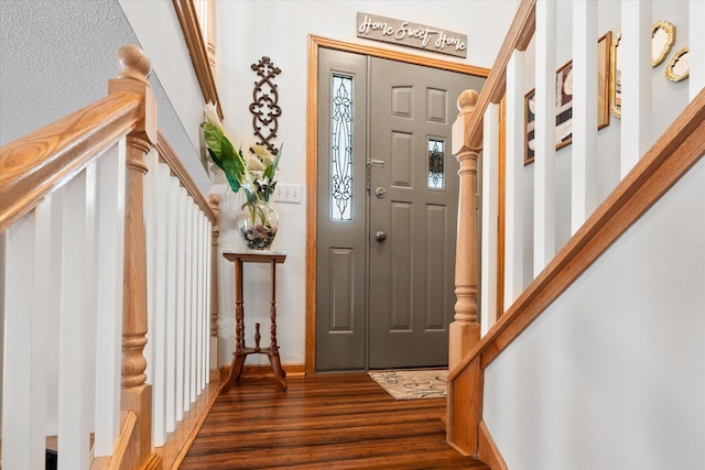 entryway featuring stairway and wood finished floors