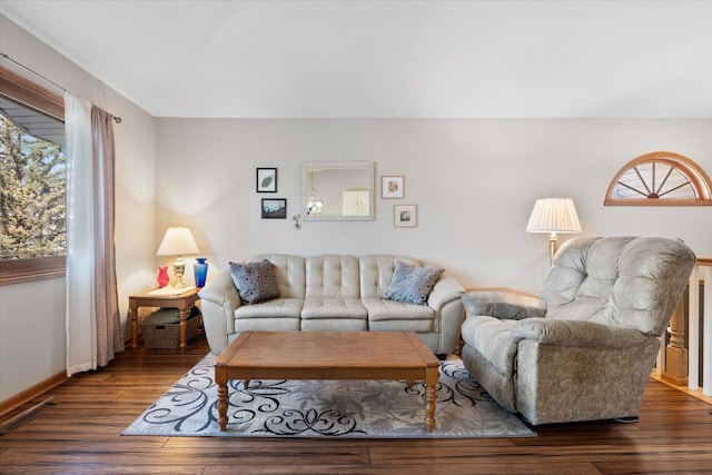 living room with baseboards and wood finished floors