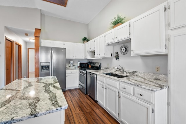 kitchen featuring white cabinets, stainless steel appliances, and a sink