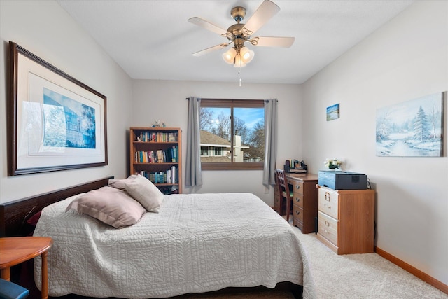 bedroom with baseboards, carpet floors, and ceiling fan