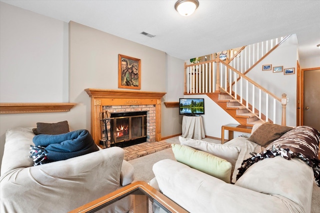 living room featuring visible vents, baseboards, stairway, carpet flooring, and a fireplace