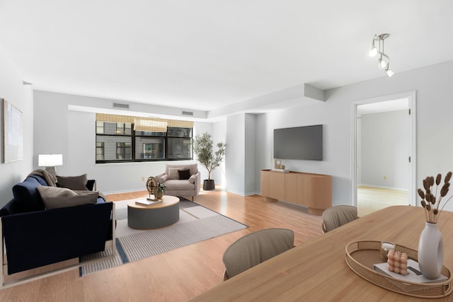 living area with light wood-style floors