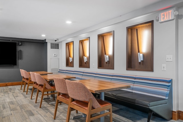 dining area with recessed lighting, baseboards, and light carpet