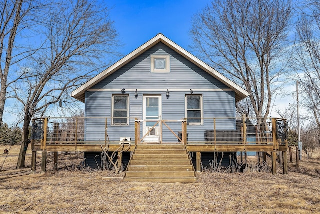 back of property featuring a deck