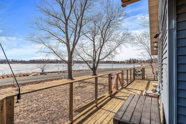 wooden terrace with a water view