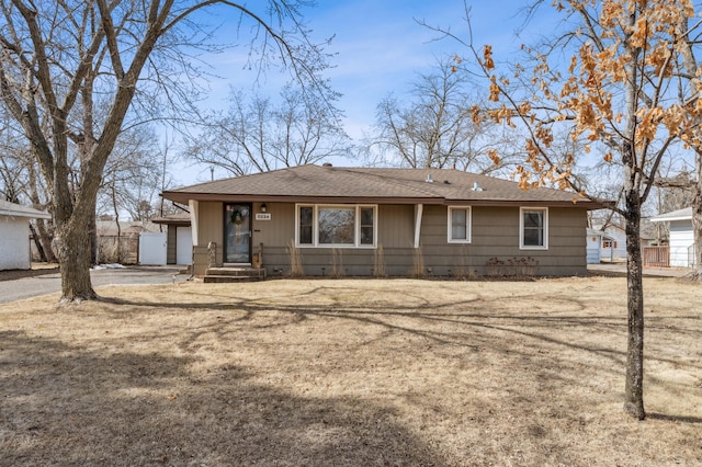 view of front of property with roof with shingles