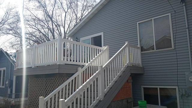 wooden terrace featuring stairs