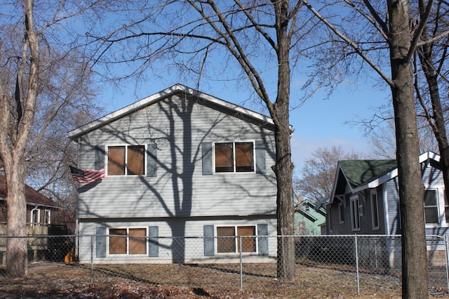 back of house featuring fence