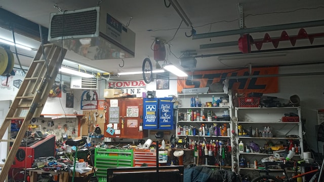 220 35th Ave N, Saint Cloud, MN 56303 - garage with a workshop area and a heating unit