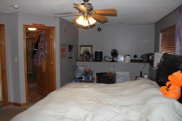 220 35th Ave N, Saint Cloud, MN 56303 - bedroom featuring a closet, ceiling fan, a textured ceiling, and a walk in closet