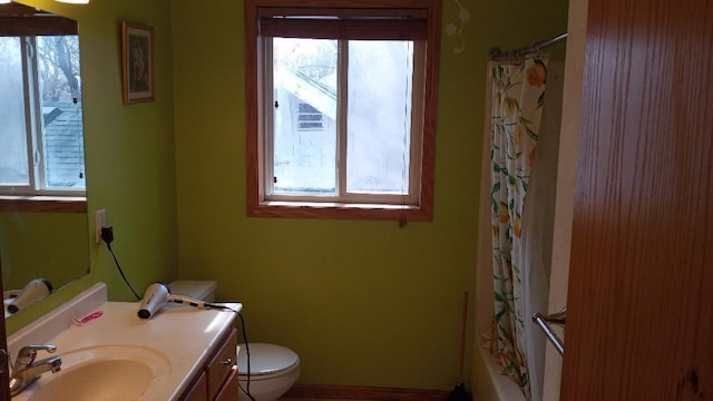 220 35th Ave N, Saint Cloud, MN 56303 - bathroom featuring plenty of natural light, vanity, and shower / bathtub combination with curtain