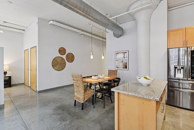 250 Park Ave Unit 606, Minneapolis, MN 55415 - dining space with a high ceiling and concrete floors