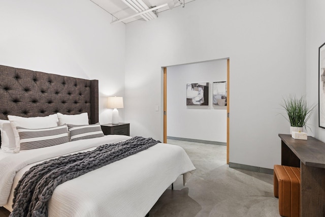 250 Park Ave Unit 606, Minneapolis, MN 55415 - bedroom with finished concrete flooring and a high ceiling
