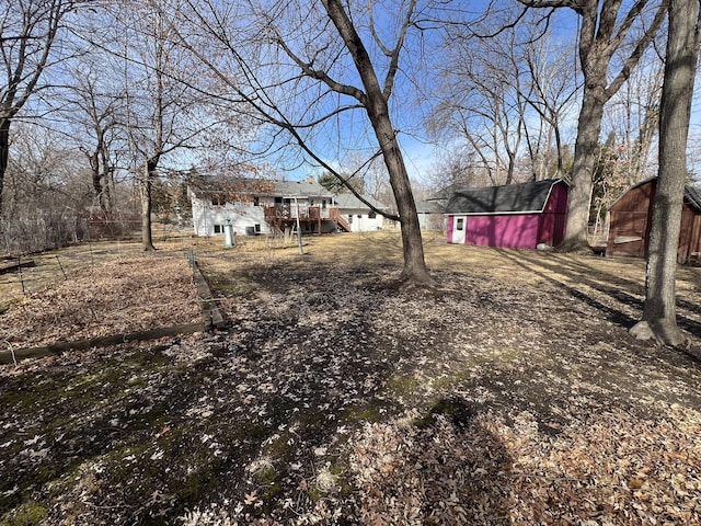 view of yard featuring a barn and an outdoor structure