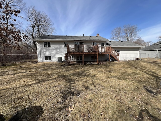 rear view of property with stairway, cooling unit, fence, a wooden deck, and a yard