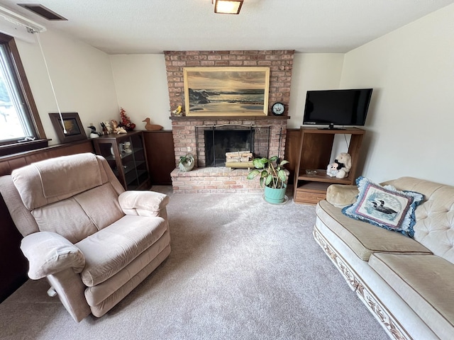 carpeted living area featuring visible vents, a fireplace, and a textured ceiling