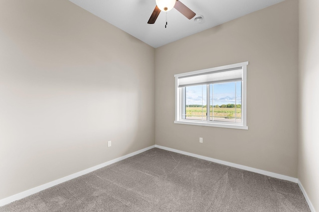 unfurnished room featuring baseboards, carpet, and a ceiling fan