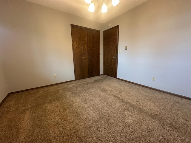 2593 6th St S, Sartell, MN 56377 - unfurnished bedroom with carpet, a closet, baseboards, and ceiling fan