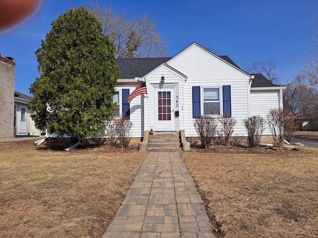 view of front of home featuring a front lawn and board and batten siding