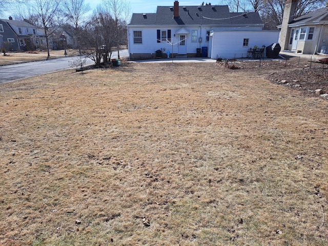 view of yard with entry steps and a patio area