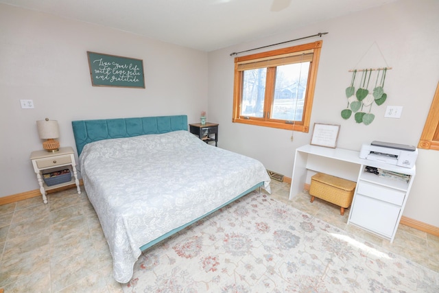 bedroom featuring baseboards