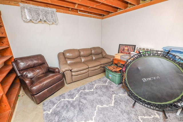 living area with concrete flooring