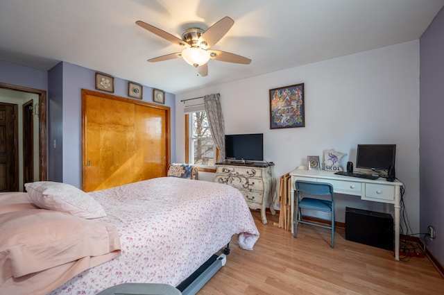 bedroom featuring a ceiling fan and light wood-style floors