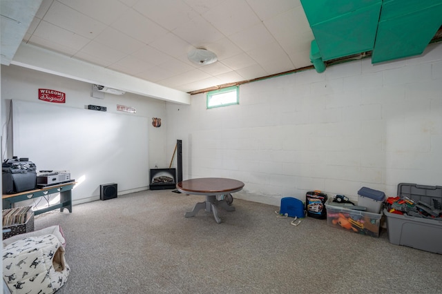 game room featuring concrete block wall