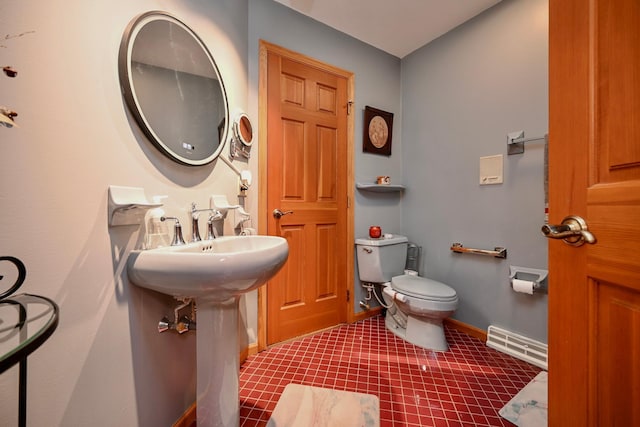 bathroom featuring visible vents, toilet, and baseboards