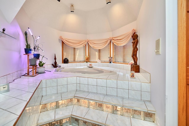 bathroom with tile patterned flooring and vaulted ceiling