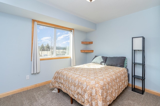 bedroom with baseboards and carpet flooring