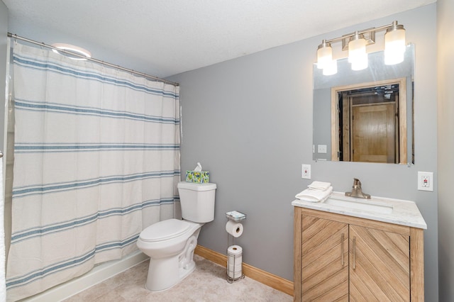 bathroom with baseboards, toilet, a shower with shower curtain, tile patterned floors, and vanity