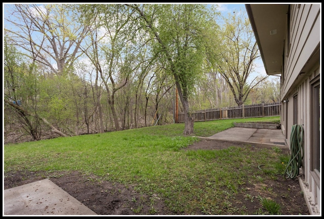 view of yard featuring a patio area and fence