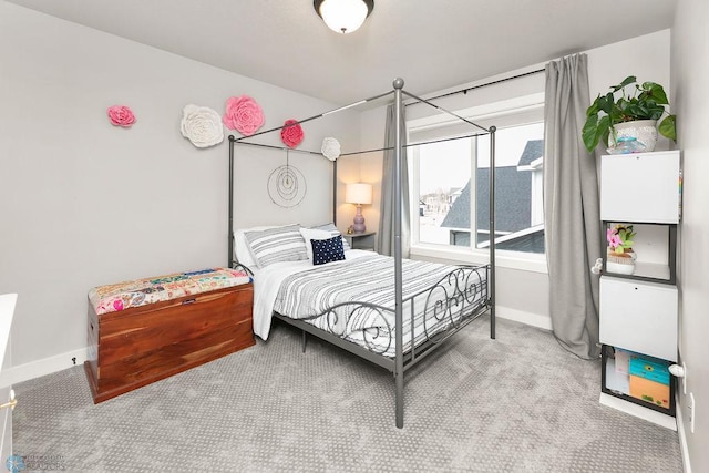 bedroom featuring carpet flooring and baseboards