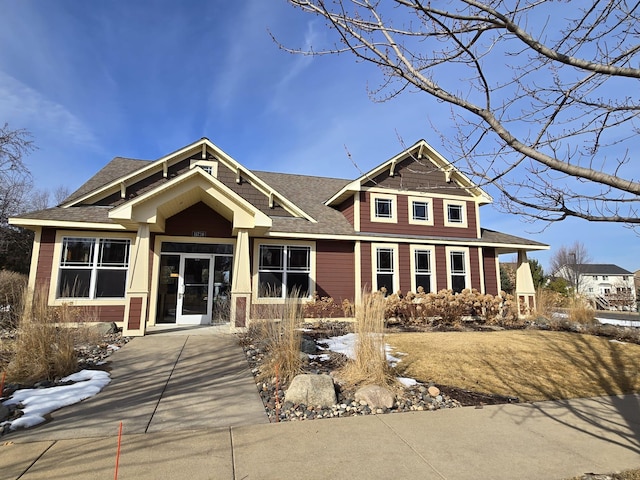 view of front of home featuring roof with shingles