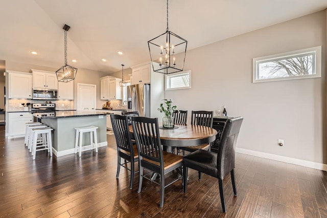 dining area with baseboards, recessed lighting, dark wood-style floors, and a notable chandelier
