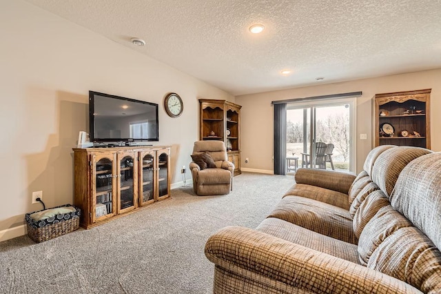 living area featuring recessed lighting, a textured ceiling, baseboards, and carpet