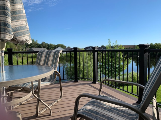 wooden terrace with a water view