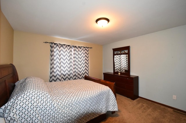 carpeted bedroom with baseboards