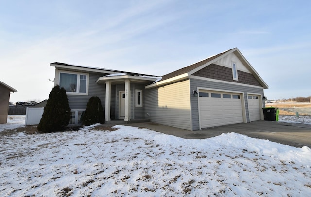 view of front of property featuring an attached garage and concrete driveway