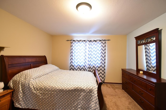 bedroom with light carpet