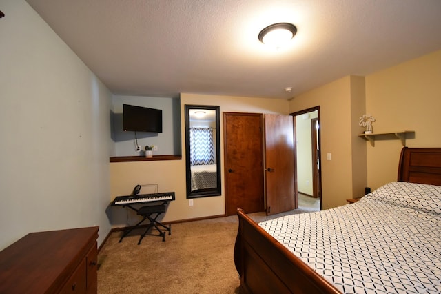 bedroom featuring light colored carpet and baseboards