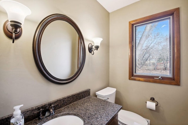 bathroom with toilet and vanity