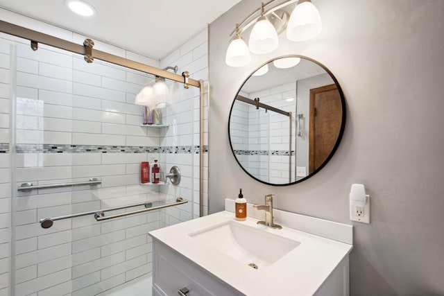 full bath featuring a stall shower and vanity