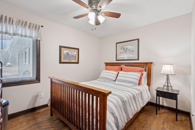 bedroom featuring wood finished floors, baseboards, and ceiling fan