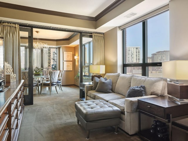 carpeted living area with an inviting chandelier, visible vents, and ornamental molding