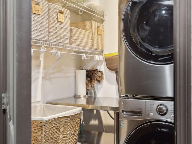 laundry area featuring laundry area and stacked washing maching and dryer