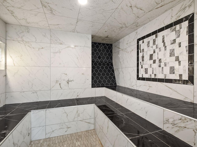 bathroom with tiled shower